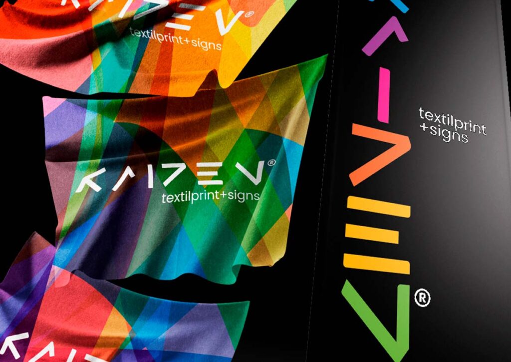 Banner Kaizen TextilPrint + Signs. Parte do Manual de Linguagem da Marca para a empresa especializada em Signs e Impressão Digital sobre Tecidos desenvolvido pela Ópera Criativa.
